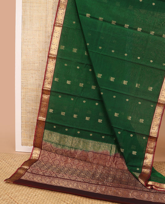 Dark green motifs silk cotton saree with intricate zari design border & floral design pallu