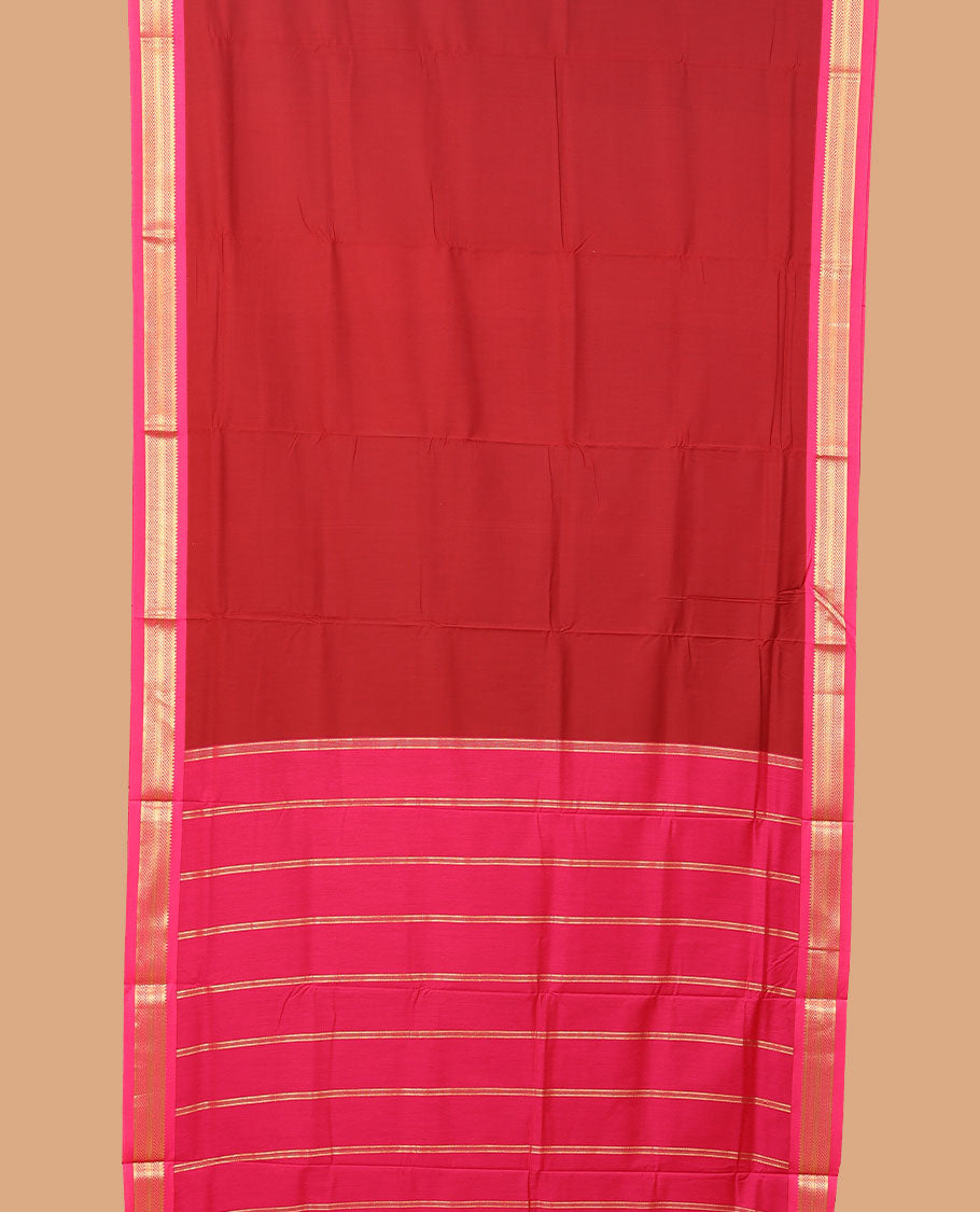 Cherry red plain nine-yard cotton saree, contrast traditional zari border, and zari striped pallu