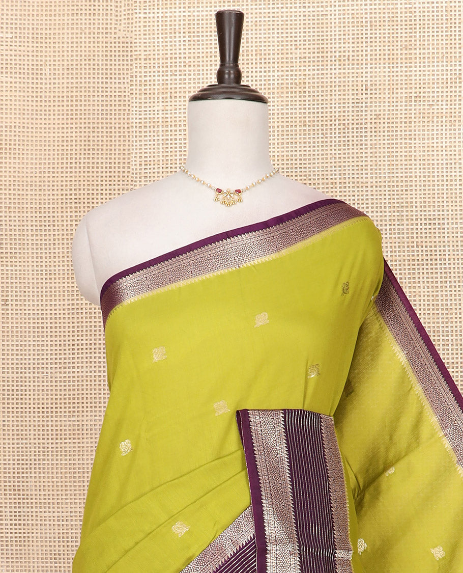 Leaf green peacock buttas Assam silk saree, contrast traditional zari border, and pallu of zari designs