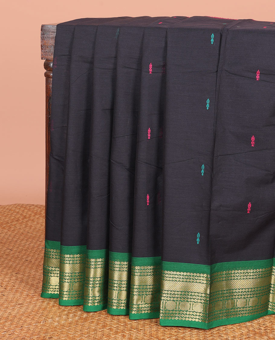 Black Chettinad Cotton Saree Prettified with Thread Buttas All Over Its Body, Complemented by a Contrast Traditional Zari Motifs Woven Ganga Jamuna Border, and a Pallu of Stripes and Buttas