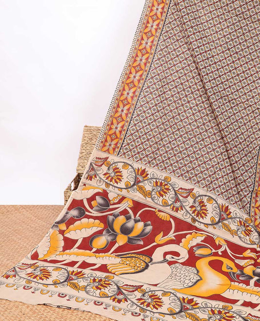 Cream floral enclosed checked design kalamkari cotton saree with contrast floral border & peacock design pallu