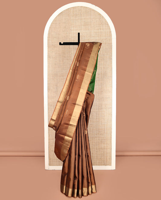 Brown Mayuri Lite Silk Mix Saree, Embellished with zari Buttas All Over Its Body, Highlighted by a Piping Border, Complemented by a Contrast Pallu of Intricate Designs, and Paired with a Contrast Blouse