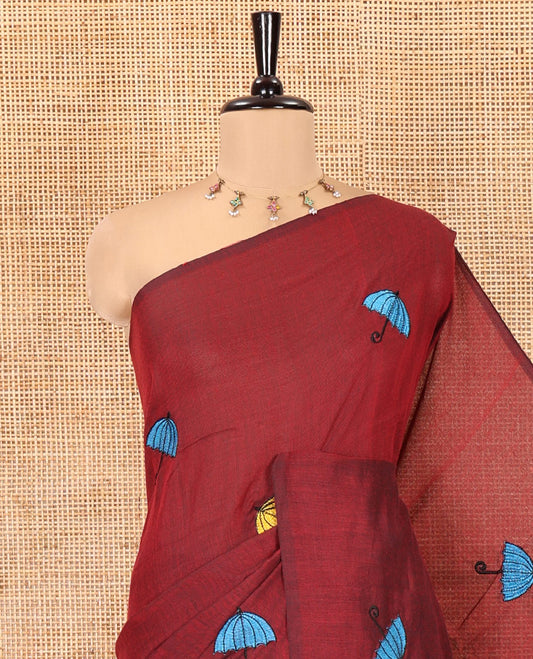 Borderless Maroon Khadi Cotton Saree, Delicately Woven with Umbrella Motifs, Thread Embroidered on Its Body, a Self-Pallu, and Paired with a Matching Blouse