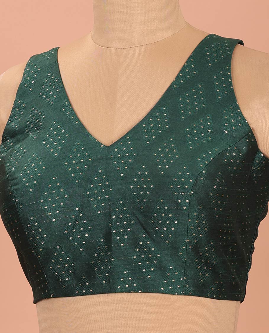 Green Readymade Blouse Steeped with Dobby-Style Buttas, Featuring a Front Leaf-Neck, Back Deep Leaf-Neck, and Sleeveless Hand