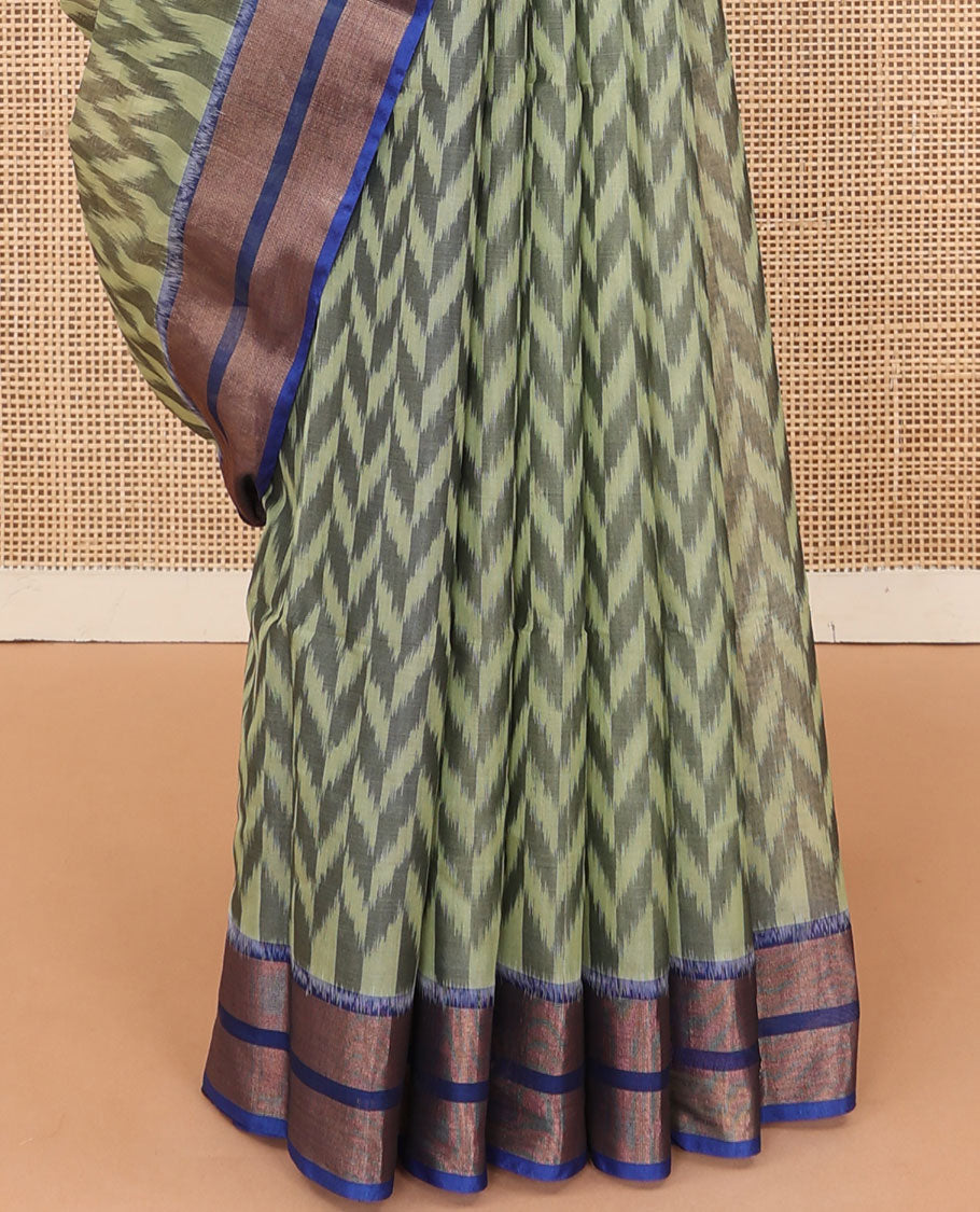 Green ikkat chevron designs silk cotton saree, contrast zari border, and pallu of ikkat designs