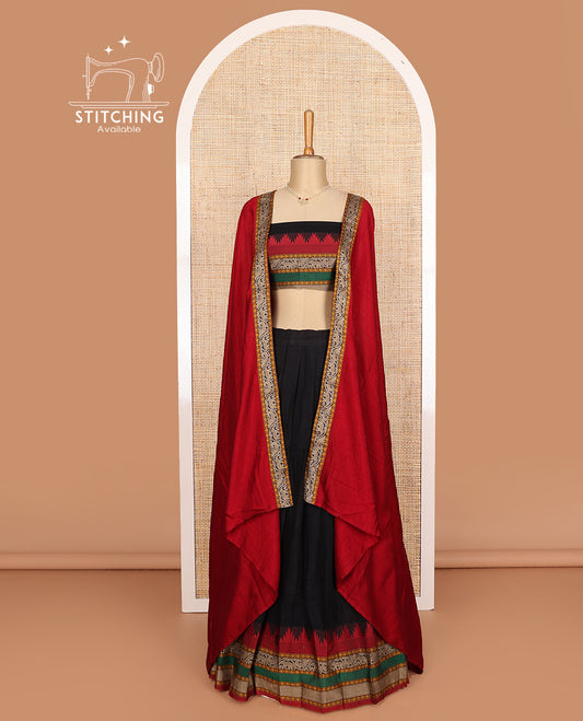 Black cotton half-saree, plain with contrast traditional motif bordered skirt, matching blouse, and contrast elephant motif dhavani