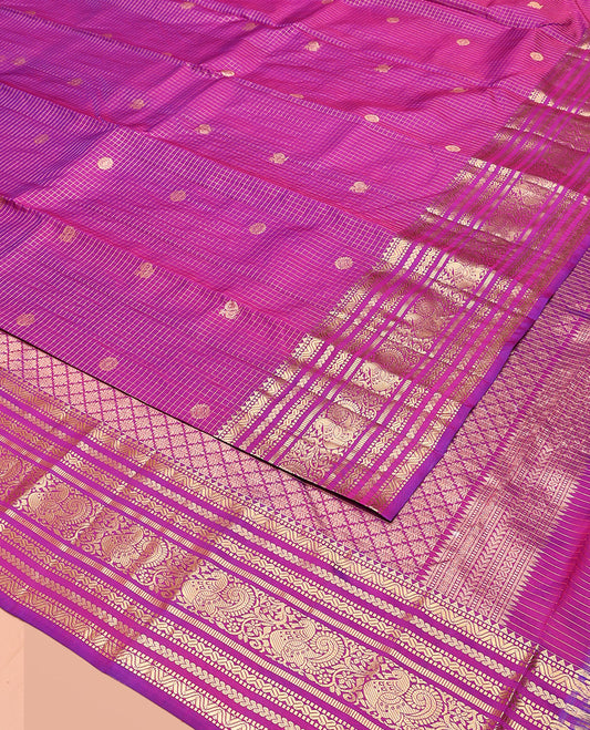 Rani Pink Vasundhara Silk Saree Gleamed Up with Zari Checks and Annam Chakram Buttas, Complemented by a Zari Border of Rekku, Muthu, Kathir, Greek Key, and Mayil Designs, Opulently Embellished Pallu, and Paired with a Matching Blouse