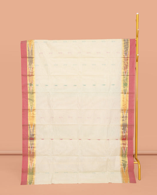 Off-White Kanchi Cotton Saree, Showcasing Buttas All Over Its Body, Complemented by a Contrast Ikkat Border, Pallu of Floral Designs, and Paired with a Matching Blouse