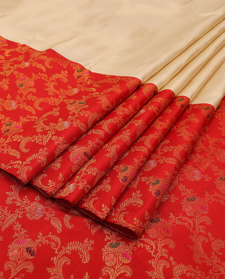 Cream embossed silk saree, contrast red border & pallu features meenakari resham thread woven floral jaal design