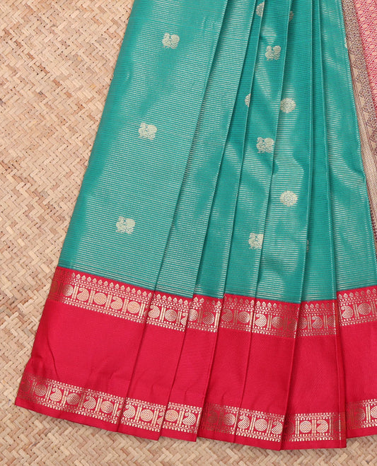 Green Budget Silk Saree, Gleamed Up with Peacock Buttas and Zari Stripes All Over Its Body, Complemented by a Contrast Traditional Zari Design Rettai Pettu Border, a Pallu of Jaal Design, and Paired with a Contrast Blouse