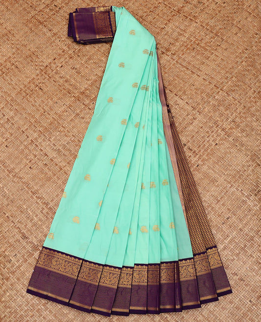 Turquoise Budget Silk Saree, Highlighted with Elephant Buttas All Over Its Body, Complemented by a Contrast Traditional Zari Design Border of Peacocks, Artfully Woven Pallu of Jaal Designs, and Paired with a Contrast Blouse