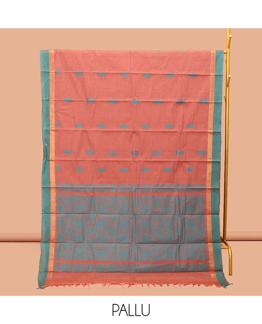 Peach Kanchi Cotton Saree, Adorned with Buttas, Complemented by a Contrast Border, Intricate Pallu, and a Matching Blouse