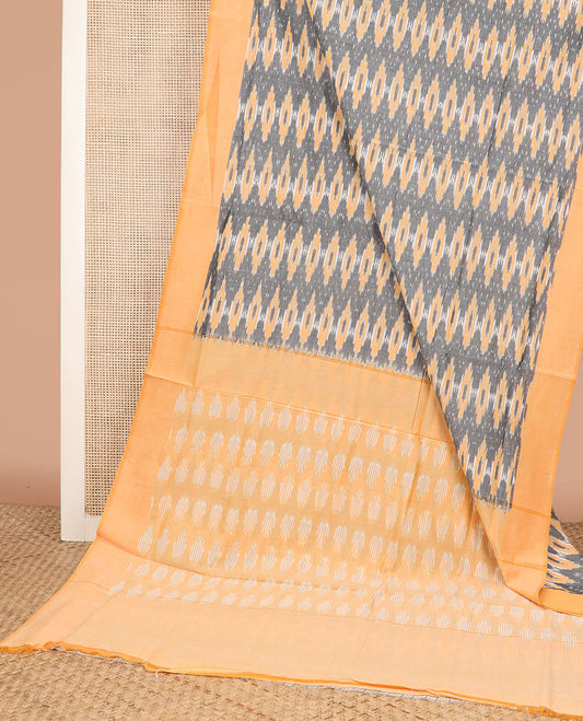 Grey Ikkat Cotton Saree Accentuated with Geometric Patterns in Hazily Ikkat Weave, Complemented by a Contrast Plain Border, and Pallu of Ikkat Patterns