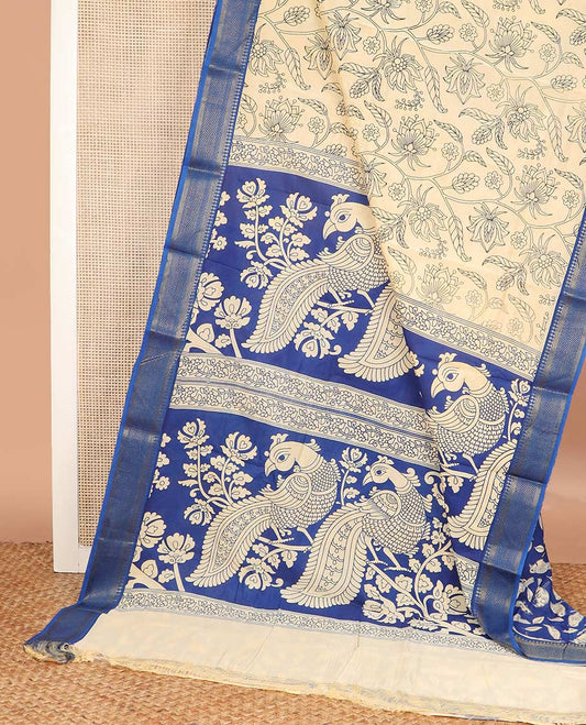 Light sandal floral vine machine printed kalamkari cotton saree, contrast traditional zari border, and pallu of peacock motifs