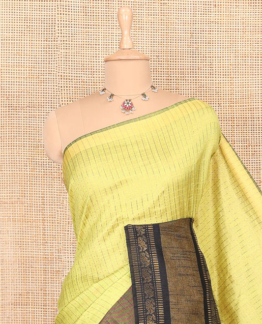 Parrot green zari dot enclosed checked semi-raw silk saree, contrast traditional zari design border, contrast diamond patterned pallu, and a contrast blouse