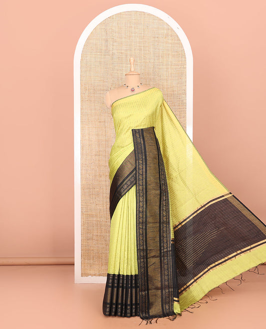 Parrot green zari dot enclosed checked semi-raw silk saree, contrast traditional zari design border, contrast diamond patterned pallu, and a contrast blouse