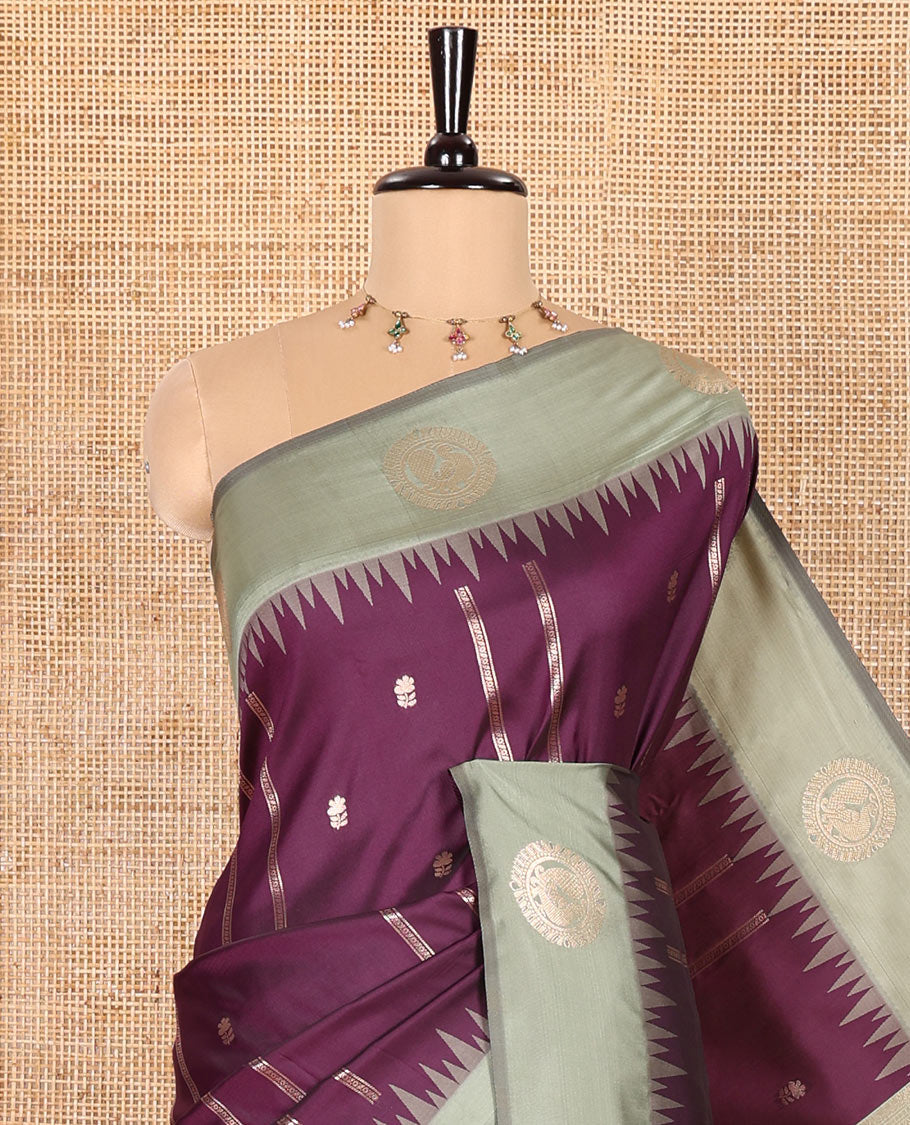 Purple Elite Soft Silk Saree, Elevated with Zari Buttas and Zari Stripes All Over Its Body, Complemented by a Contrast Temple Border of Round Peacock Designs, Rich Pallu of Peacock Chakram Butta Enclosed Checks, and Paired with a Contrast Blouse