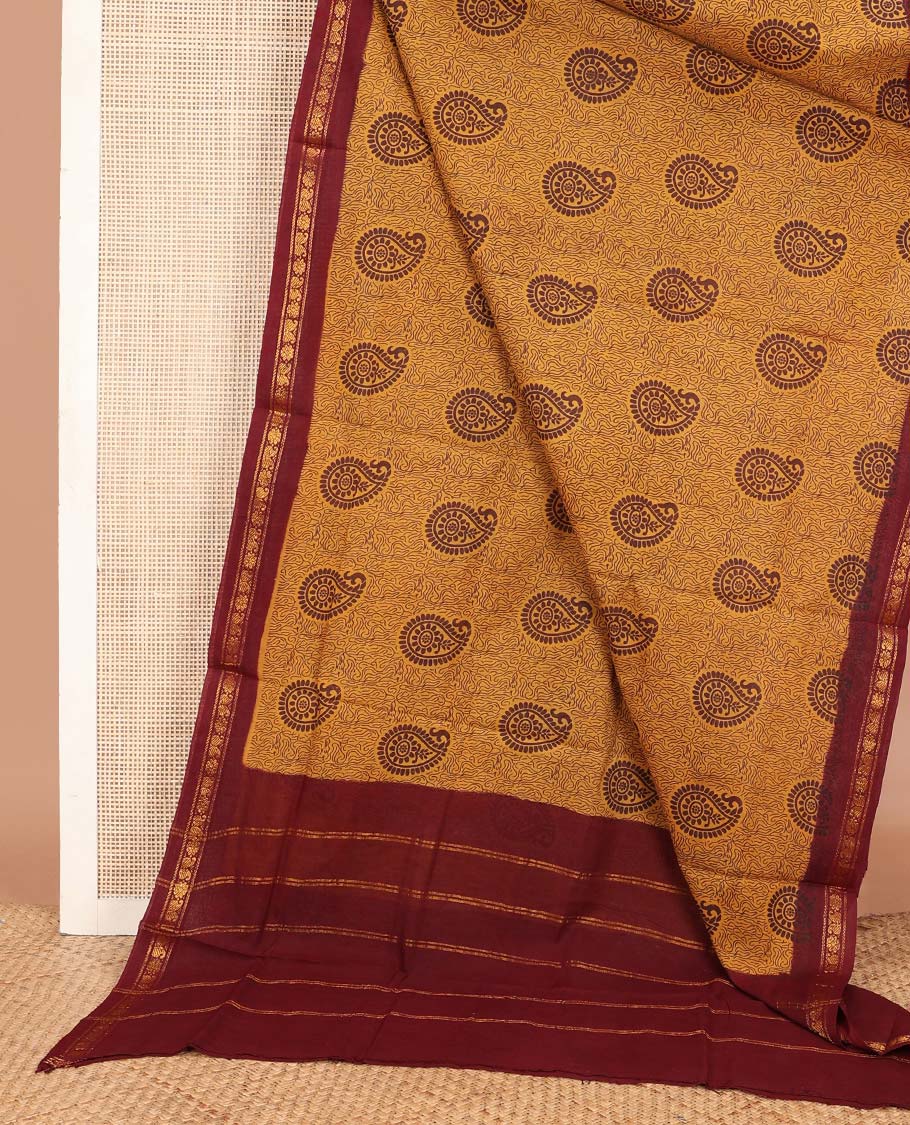 Mustard paisleys printed Sungudi cotton saree, contrast zari border & zari striped pallu