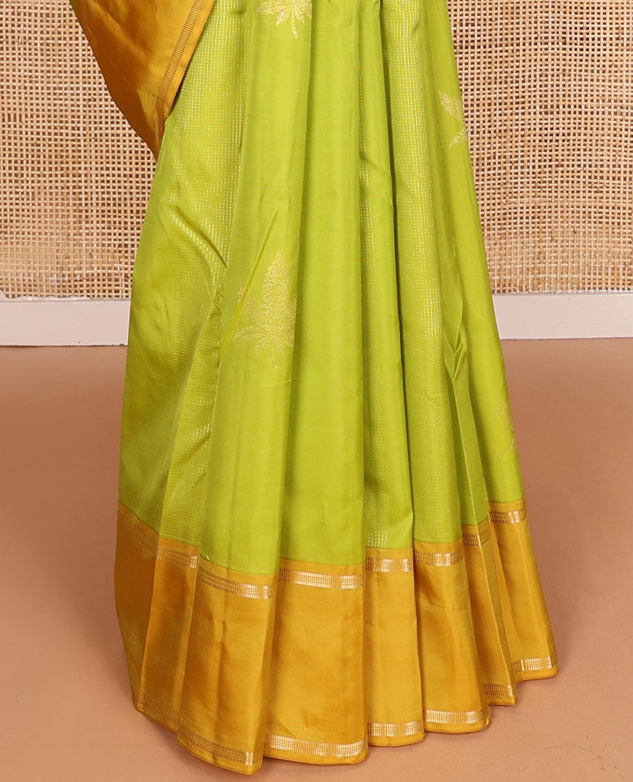 Parrot green zari design Vasundhara silk mix saree, contrast rettai pettu border of muthu designs, and jaal pallu