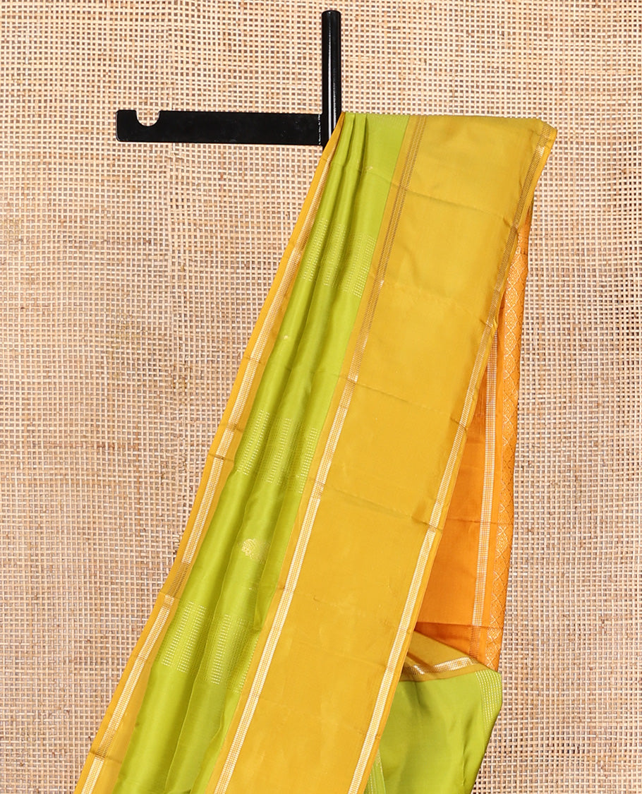 Parrot green zari design Vasundhara silk mix saree, contrast rettai pettu border of muthu designs, and jaal pallu