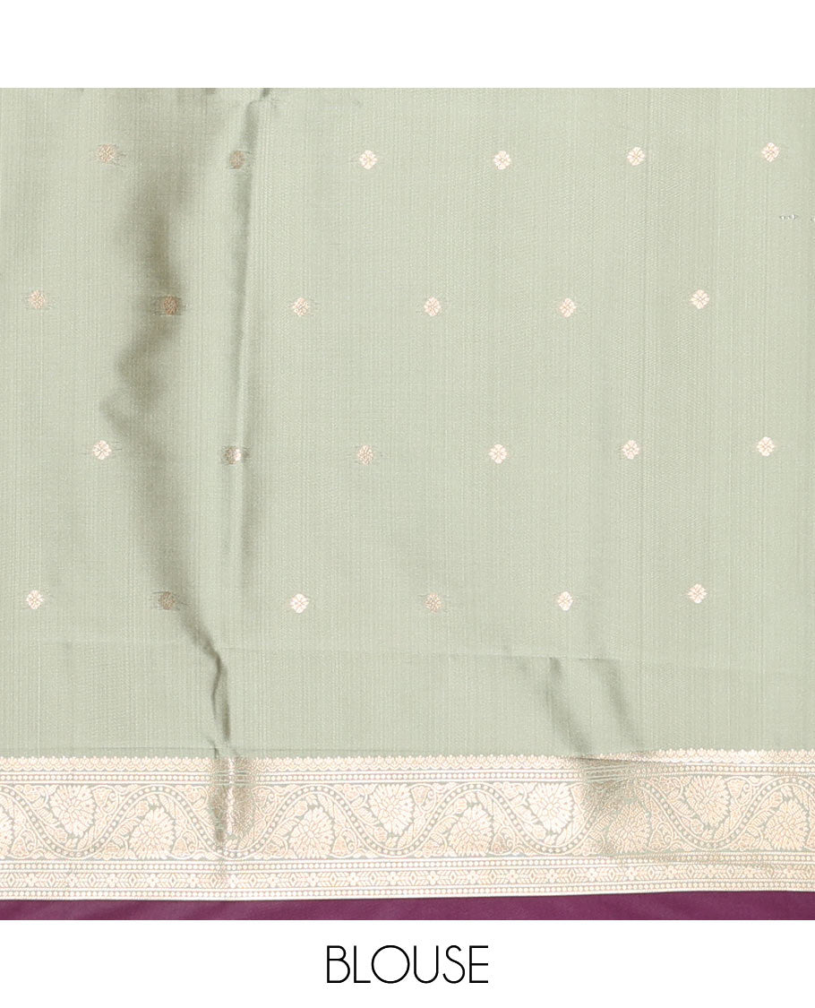 Purple Elite Soft Silk Saree, Elevated with Zari Buttas and Zari Stripes All Over Its Body, Complemented by a Contrast Temple Border of Round Peacock Designs, Rich Pallu of Peacock Chakram Butta Enclosed Checks, and Paired with a Contrast Blouse