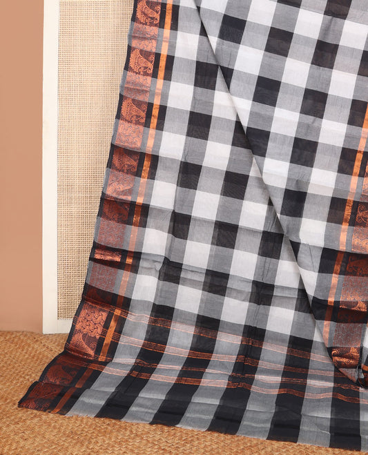Black and white checked Chettinad cotton saree, copper zari border of intricate paisley design weave & striped pallu