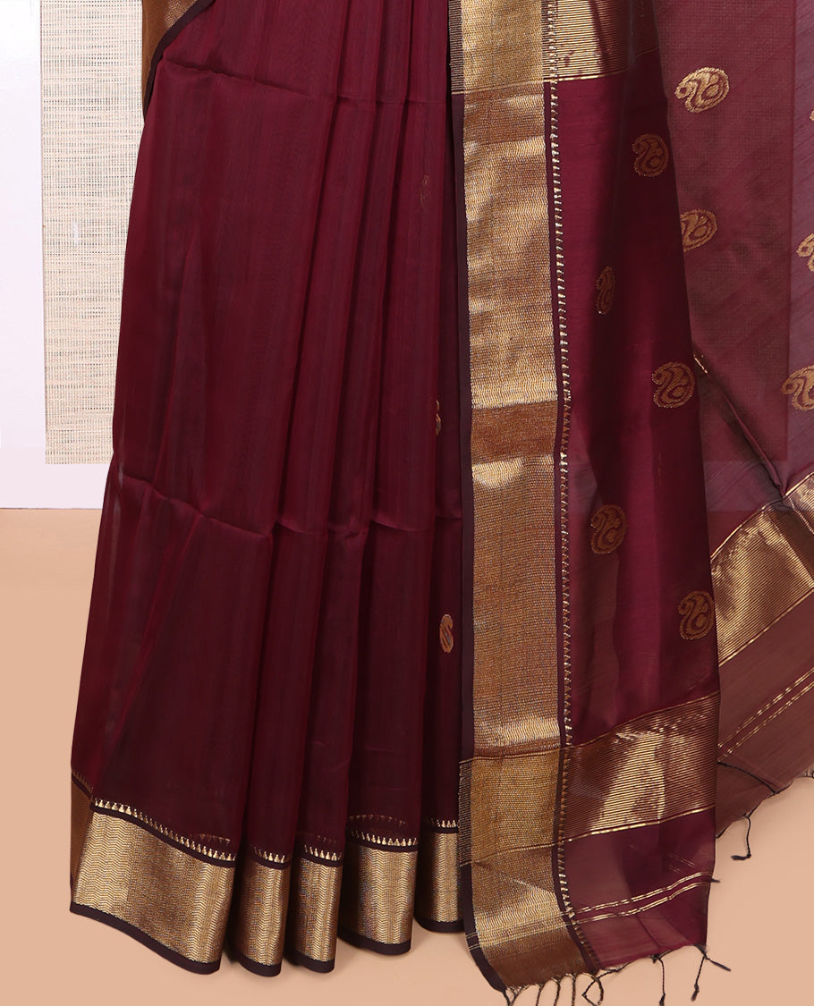 Maroon Maheshwari Cotton Saree, Adorned with Buttas, Highlighted by a Traditional Zari Border, Pallu Gleamed Up with Zari Buttas, and a Matching Blouse
