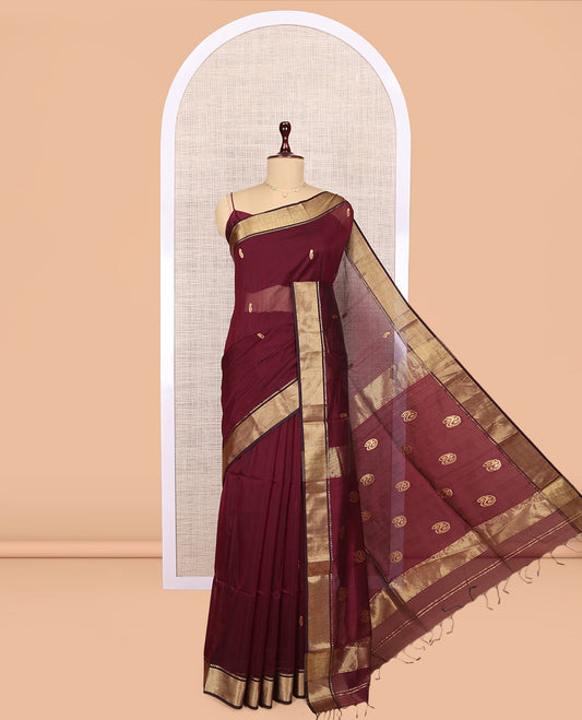 Maroon Maheshwari Cotton Saree, Adorned with Buttas, Highlighted by a Traditional Zari Border, Pallu Gleamed Up with Zari Buttas, and a Matching Blouse