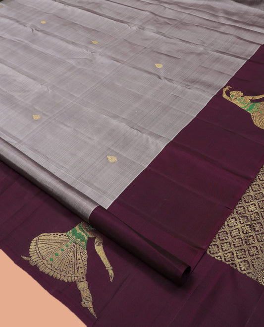 Grey Kanchipuram Silk Saree, Adorned with Zari Buttas, Complemented by a Contrast Bharatanatyam Dancer Figurines Woven Border, Jaal Pallu, and Contrast Blouse