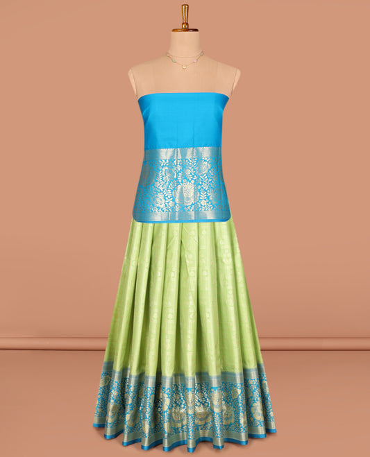 Green Art Silk Pavadai Material Set, Subtly Sparkled with Jacquard Designs on Its Skirt, Complemented by a Contrast Floral Zari Design, Delicately Woven Border, and Paired with a Contrast Blouse
