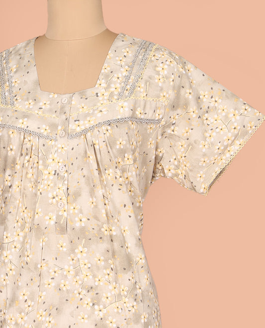 Beige Cotton Nighty Subtly Sparkled with Floral Print, Featuring Lace Work, Square Front Neck, and Half  Sleeves