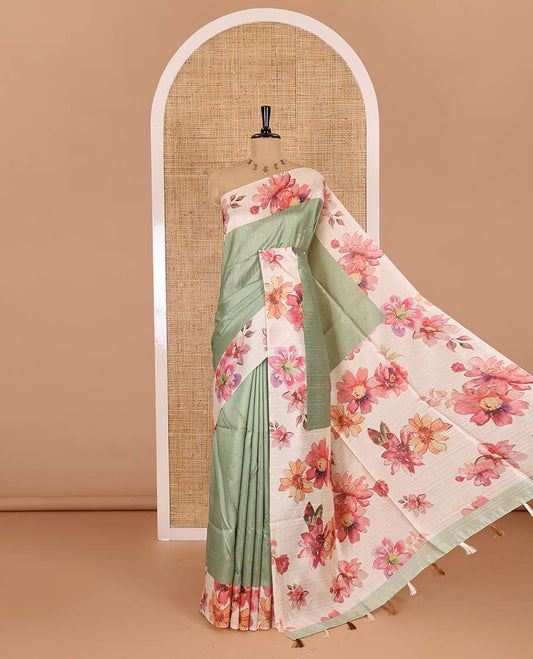 Elaichi green plain fancy tussar digital printed saree, contrast floral digital printed border, floral printed pallu, and a floral printed blouse