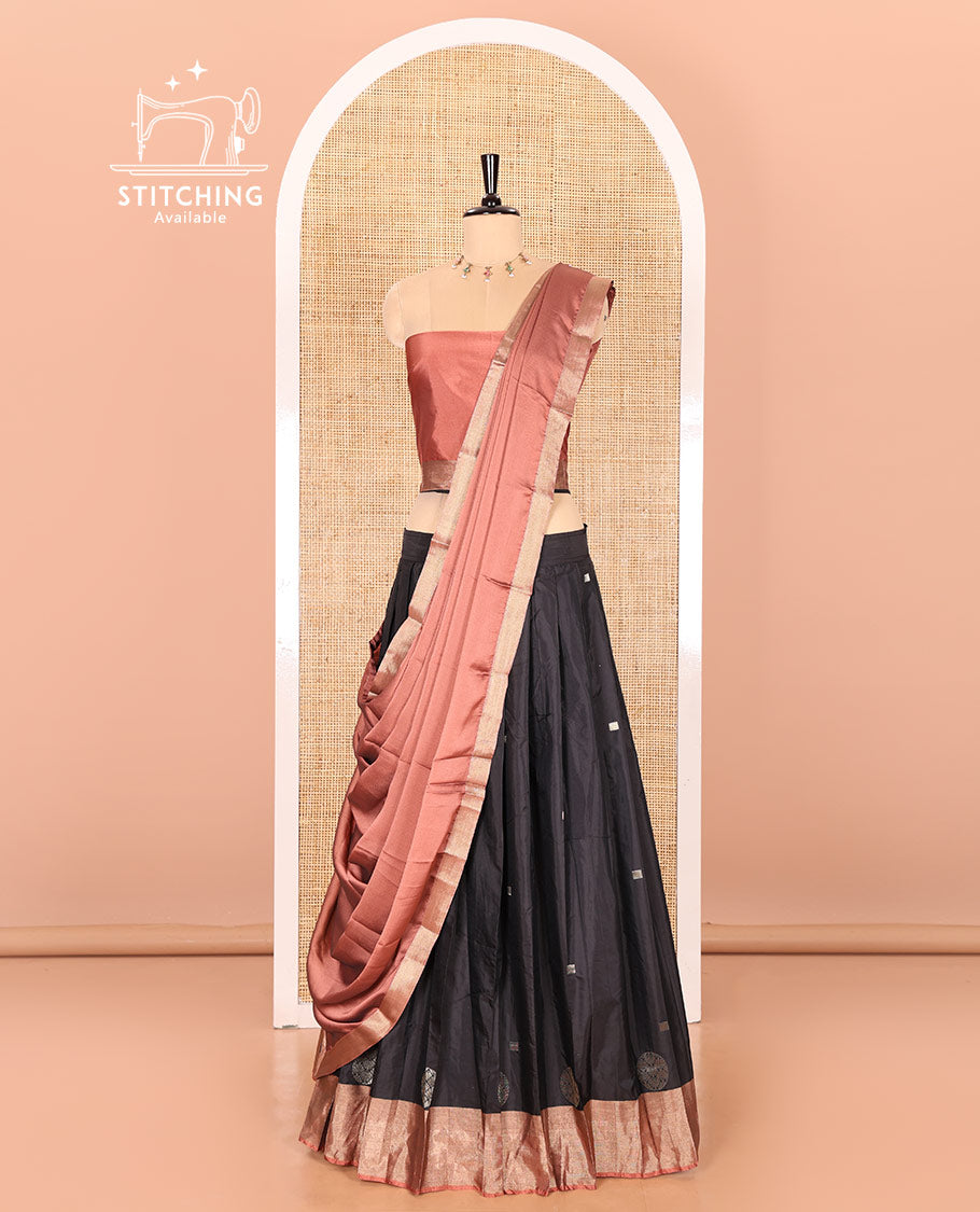 Black and rust half-saree with buttas with contrast traditional bordered taffeta silk skirt, a matching blouse, and a contrast bordered syska georgette dhavani