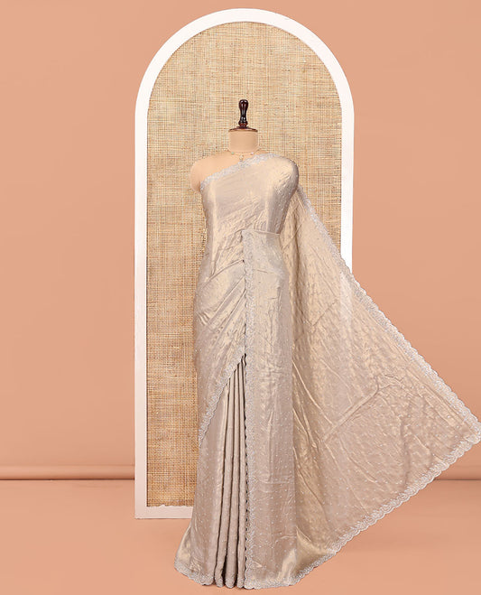 Champagne Designer Saree, Gleamed up with Stone Struck All Over Its Body, Scallop Stone Embroidered Border, and Heavy Embroidered Matching Blouse