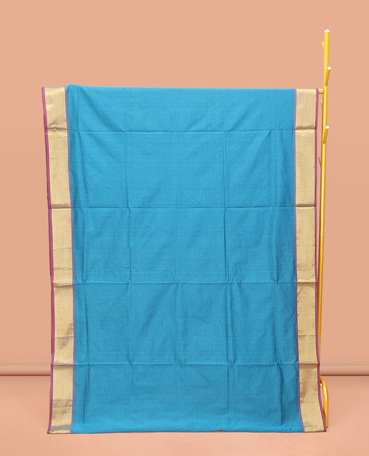 Blue Poly Cotton Saree, Sparsely Threaded with Stripes on Its Body, Complemented by Contrast Peacock-Eyed Border, Striped Pallu, and Paired with a Contrast Blouse
