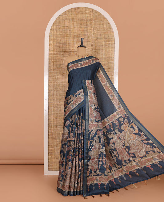 Peacock blue kalamkari human figurines printed fancy tussar saree, floral printed border, human figurines printed pallu, and a matching blouse