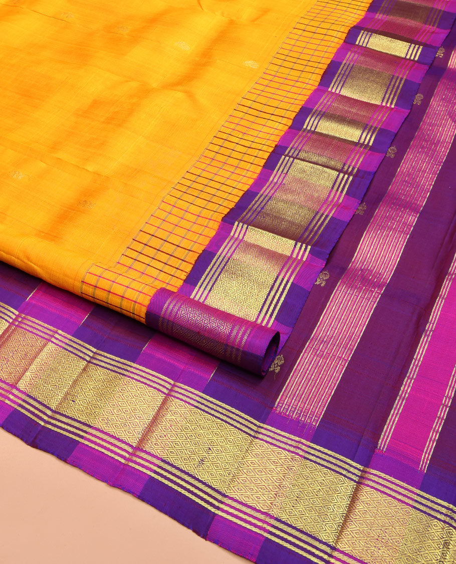 Yellow Kanchipuram Silk Saree, Bedecked with Zari Buttas on Its Body, Complemented by Contrast One-Sided Korvai Border of Banaras, and Mayil Kann Designs, Pallu Features Zari Designs, and Comes Without a Blouse