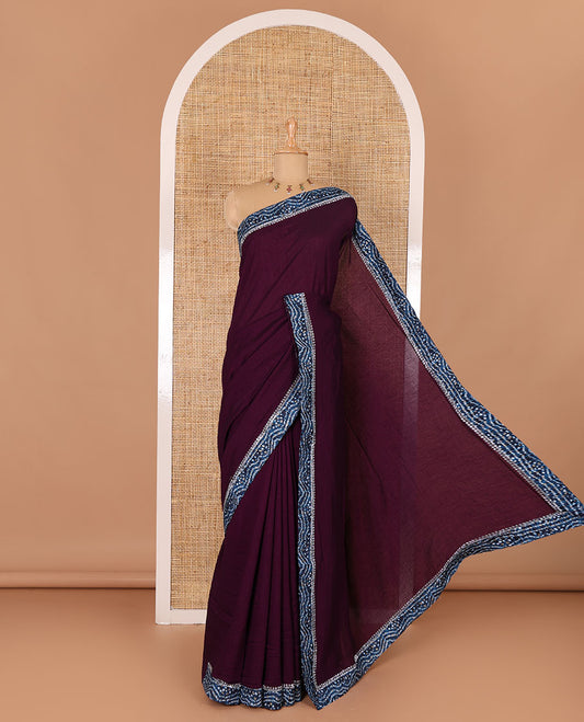 Wine plain Vichitra silk saree, contrast bandhani printed with Swarovski micro-stonework border, and a contrast bandhani printed blouse