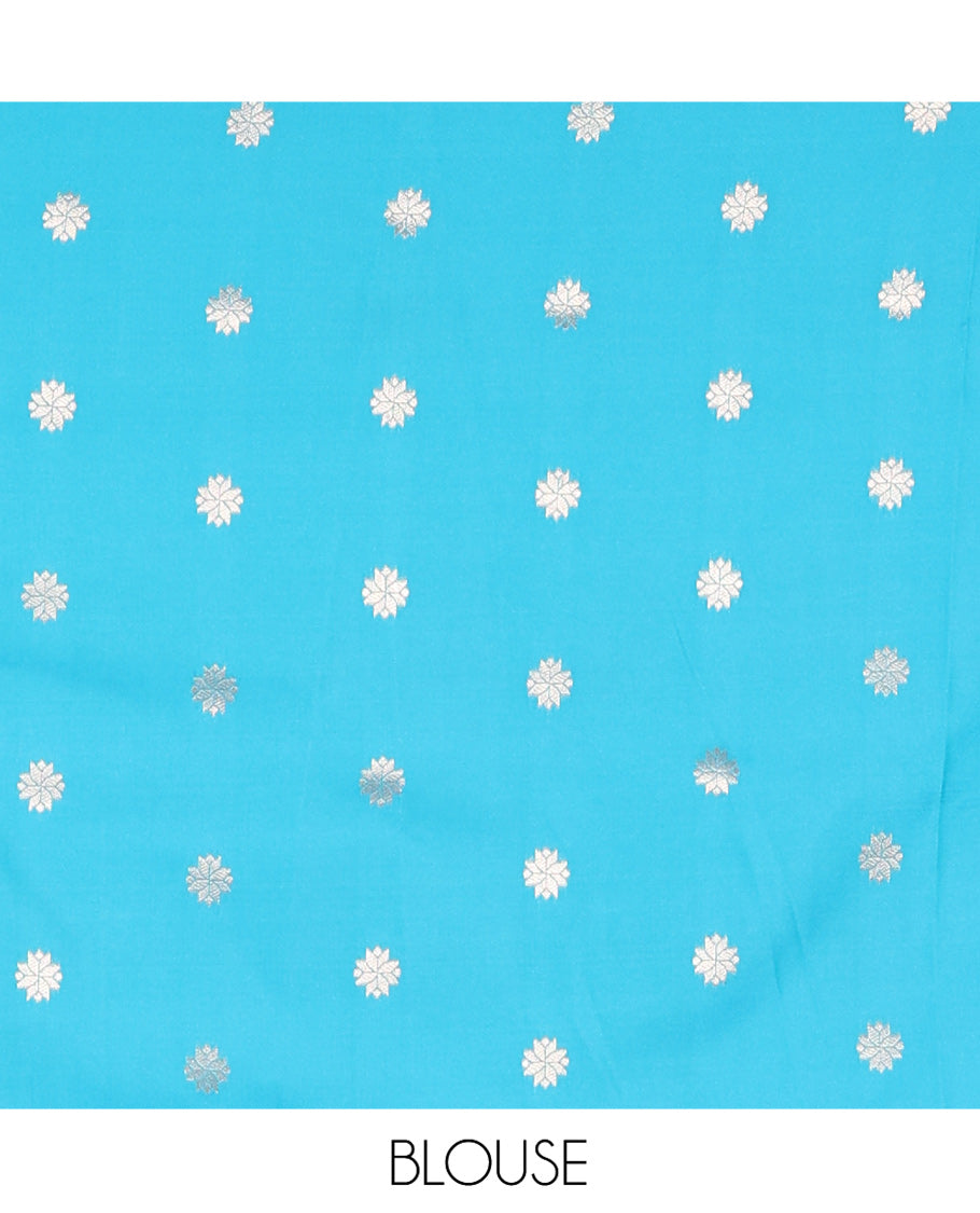 Sky Blue Elite Soft Silk Saree, Showcasing Zari Buttas on Its Body, Complemented by a Contrast Peacock-Floral Zari Blouse, Intricately Designed Pallu, and Paired with a Contrast Blouse