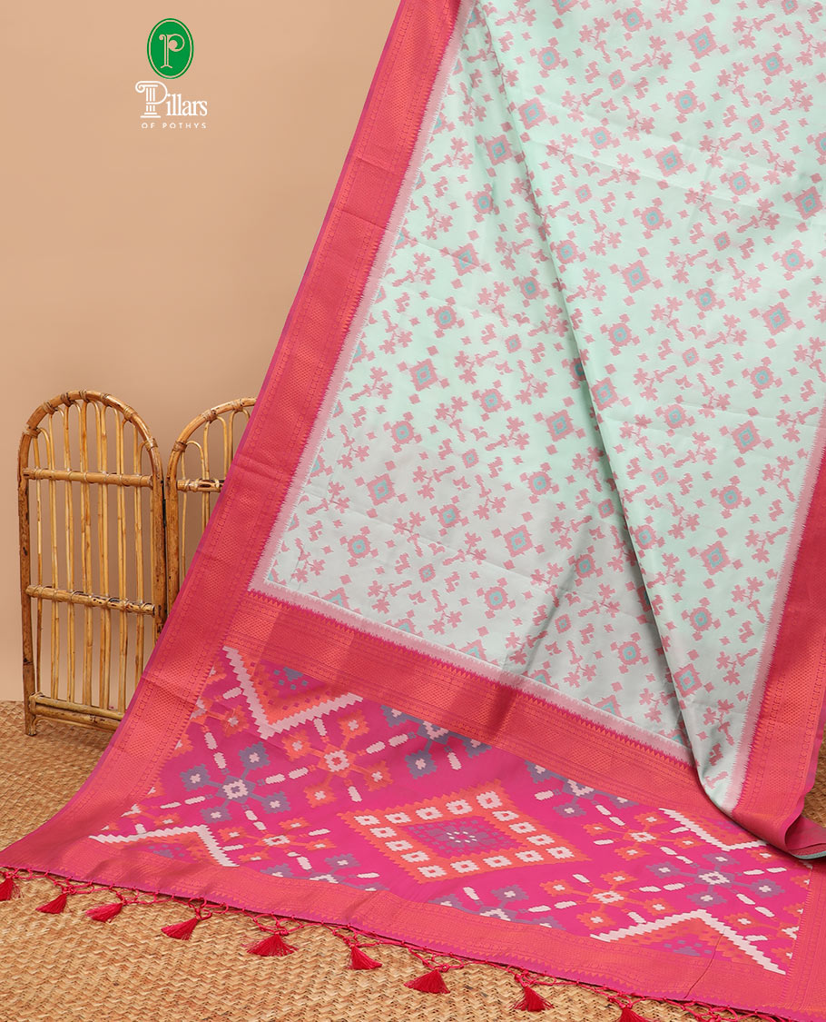 Mint green ikkat design mulberry silk saree with contrast border & ikkat pallu along with self embosed butta blouse