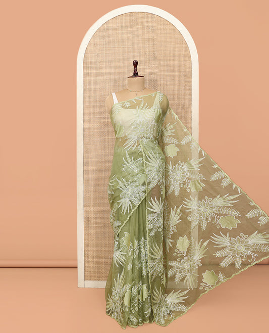 Green Organza Saree Beautified with Tropical Floral Embroidery, a Subtle Scallop Border, and a Matching Blouse