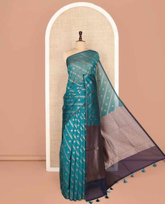 Borderless Green Chanderi Cotton Saree, Adorned with Zari Buttas and Temple Stripes on Its Body, Complemented by Contrast Pallu of Jaal Designs, and Paired with a Contrast Jacquard Blouse