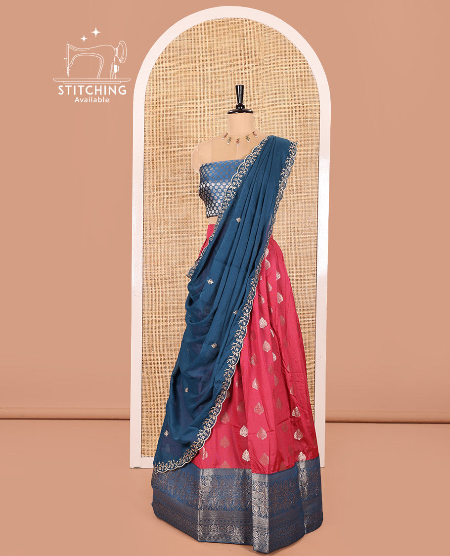 Peacock Blue and Rani Pink Semi-Banaras Silk Half-Saree Featuring Zari  Buttas All Over the Skirt, Highlighted with a Contrast Traditional Zari Design Border, Rudraksham Motifs Woven Blouse, and a Shimmer Georgette Scallop-Embroidered Dhavani