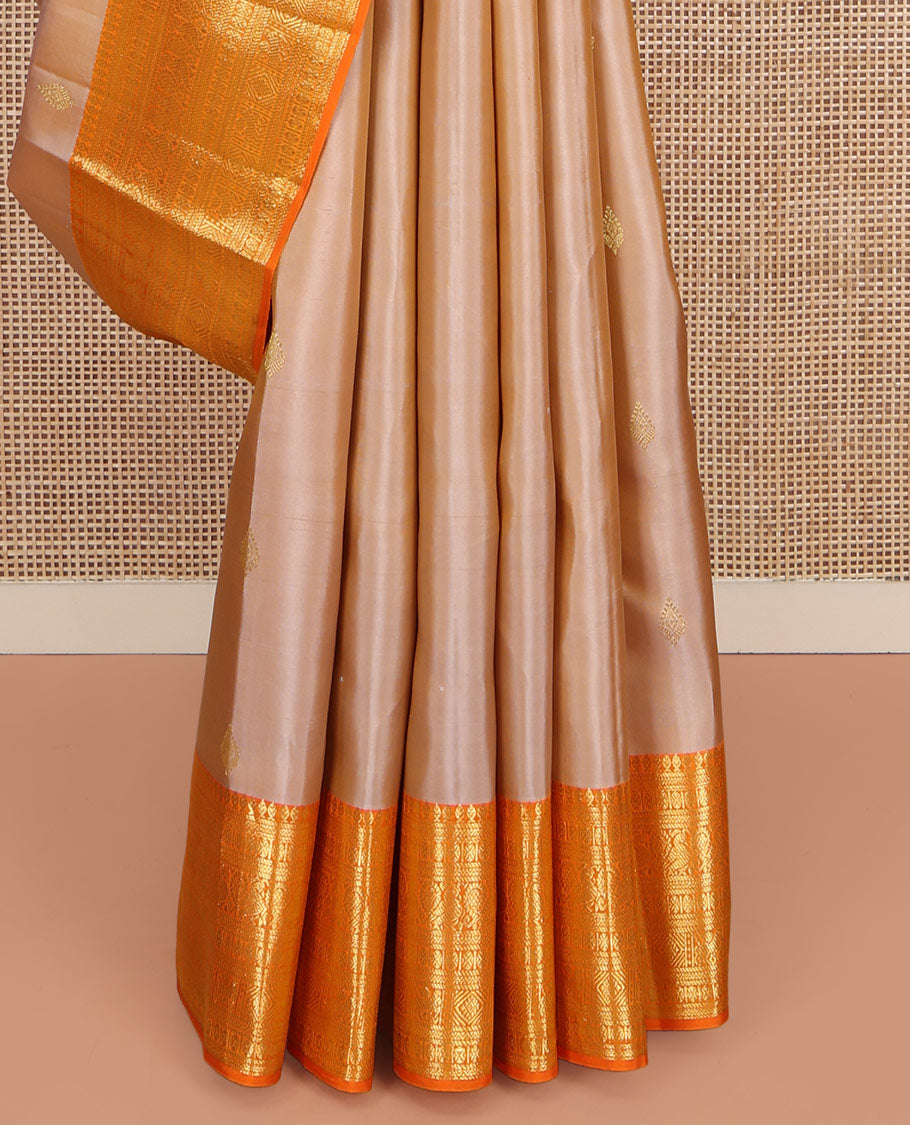 Sandal Kanchipuram Silk Saree, Finely Crafted with Zari Buttas All Over Its Body, Complemented by a Contrast Border of Thilakam Mokku, Poun, Neli, Mayil, and Kuthirai Designs, Pallu of Jaal Designs, and Paired with a Contrast Blouse