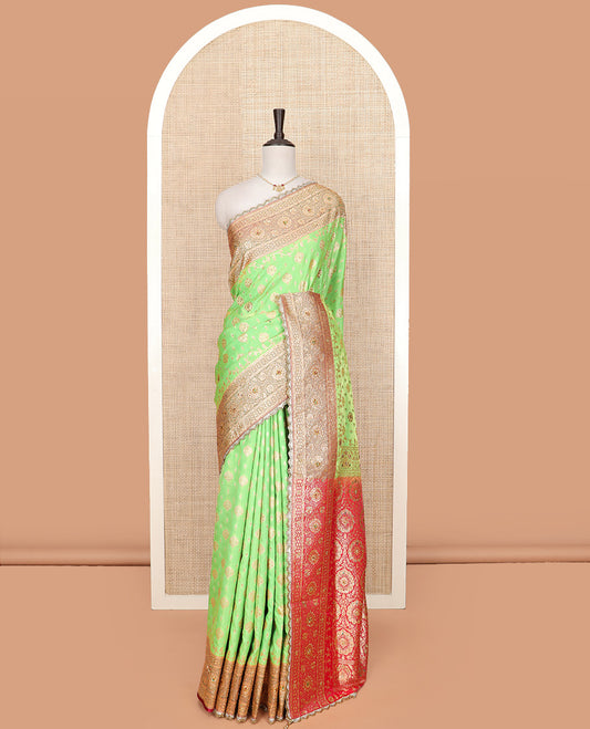 Green buttas and stone work banarasi silk saree, contrast traditional zari and stone work lace border, and pallu of intricate designs and stone work