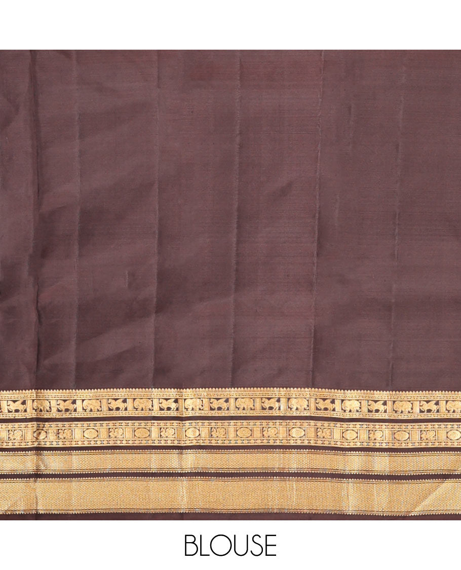 Green Vasundhara Silk Saree, Detailed with Mayil-Chakram Buttas, a Contrast Border of Thikalam, Neli, Kuthirai, Yaanai, Mayil, Chakra, and Mayil Kann, Grand Pallu, and a Contrast Blouse