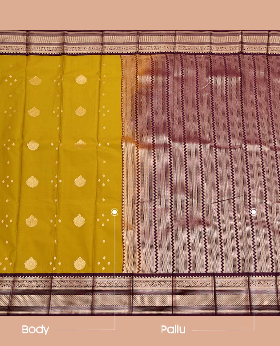 Green Budget Silk Saree, Detailed with Zari Buttas All Over Its Body, Complemented by a Contrast Zari Border of Traditional Designs, Pallu Steeped with Geometric Designs, and Paired with a Contrast Blouse