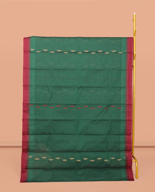 Green Kanchi Cotton Saree, Accentuated with Buttas All Over Its Body, Complemented by a Contrast Border, Pallu of Floral Design, and Paired with Matching Blouse
