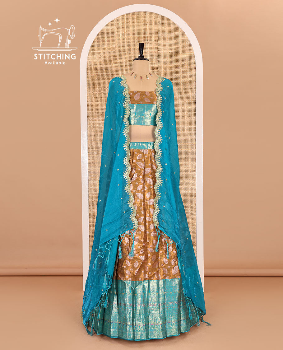 Mustard and rama color half-saree, leaf jacquard with contrast traditional bordered banarasi tissue skirt, a matching blouse, and a contrast scallop embroidered fendi organza dhavani