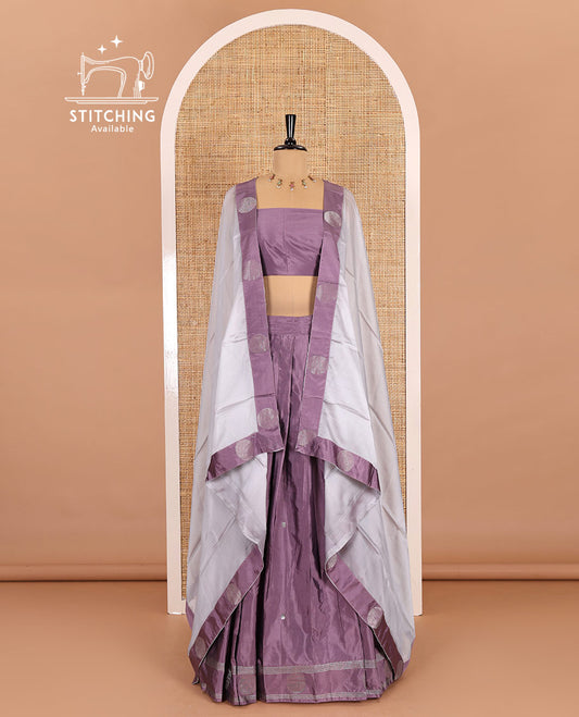 Light voilet half-saree, buttas with self-bordered taffeta silk skirt, a plain blouse, and a contrast round butta bordered satin georgette dhavani